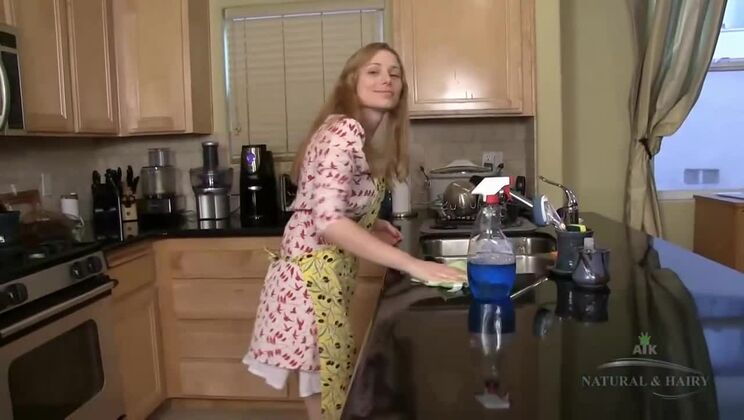 Heidi masturbates her hairy cunt in the kitchen